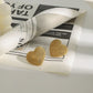 18k gold heart-shaped earrings with grainy design